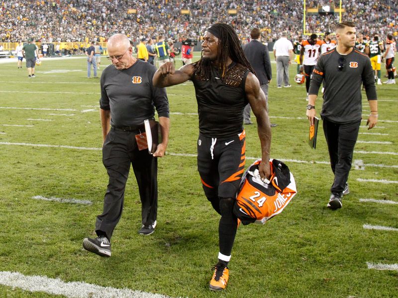 Cincinnati Bengals cornerback Adam Jones (24) talks to Cincinnati Bengals secondary coach Kevin Coyle after the 27-24 loss to the Green Bay Packers, Sunday, Sept. 24, 2017, at Lambeau Field in Green Bay, Wisconsin.