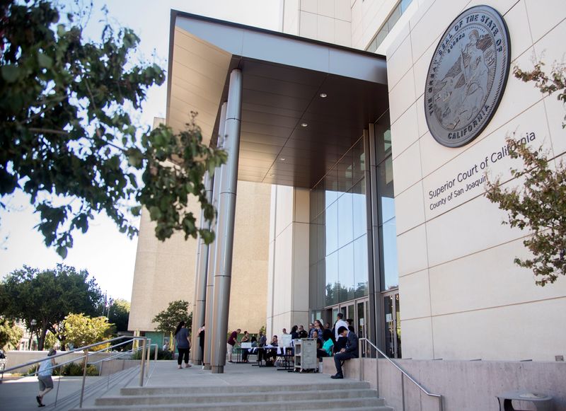 (9/3/19)Representatives from the San Joaquin County Superior Court departments set outside the courthouse to let people know the the courthouse in downtown Stockton, along with the Manteca and Juvenile Hall courts, were closed due to the Sheriff's Office per deem deputies did showing up for work. [CLIFFORD OTO/THE RECORD]