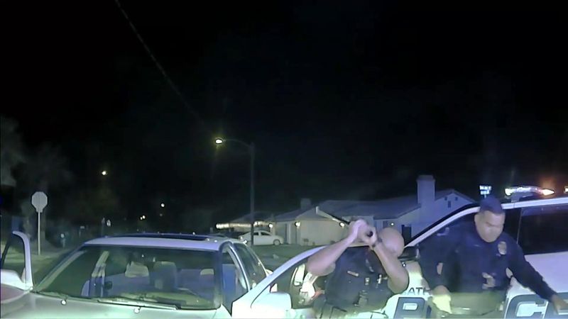 A still from video shows then-Officer Jeffrey Aguirre beating a suspect with a baton during an arrest, a use of force the Cathedral City Police Department later ruled unjustified.