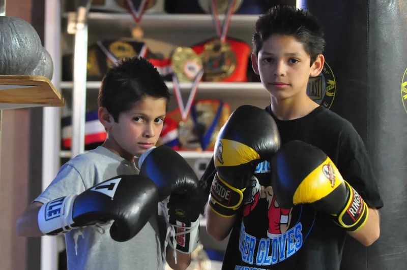 Ryan Garcia, right, and his younger brother Sean pose with their boxing gloves on in their garage in this file photo from 2011.