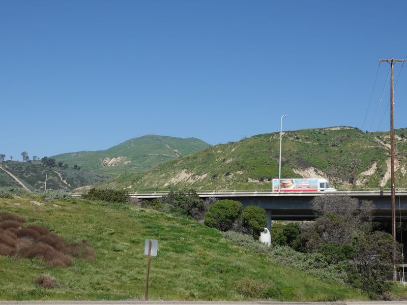Winter rains have greened hillsides along Highway 101 near the Seacliff interchange north of Ventura.