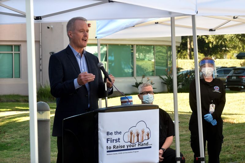 Mike Powers, former county executive officer, speaks with reporters during a news conference in Oxnard in December 2020.