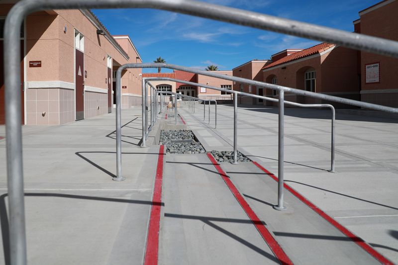 Steps outside Palm Springs High School.