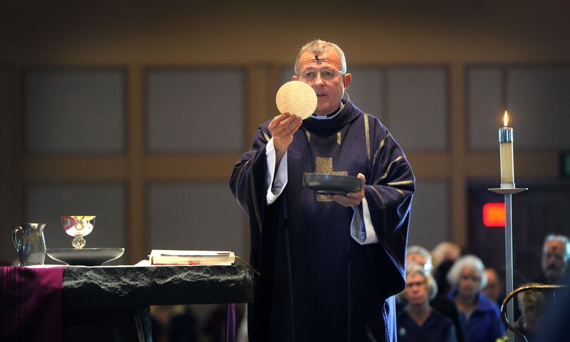 The Rev. Patrick Mullen, pastor of Padre Serra Catholic Church in Camarillo, presides at Ash Wednesday Mass.