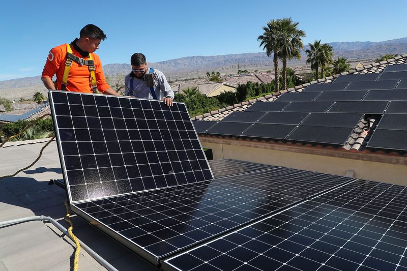 Renova Energy workers installing solar panels in 2022 in Palm Desert.