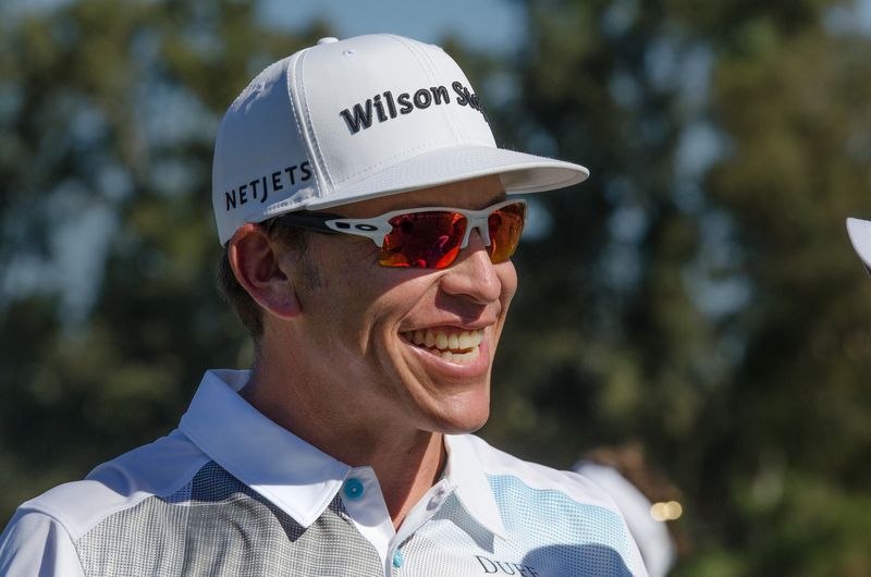 Pro golfer Ricky Barnes talks with friends on the driving range at the fourth annual Ricky Barnes Charity Pro-Am golf tournament held at the Stockton Golf and Country Club in Stockton on Oct. 12, 2015.