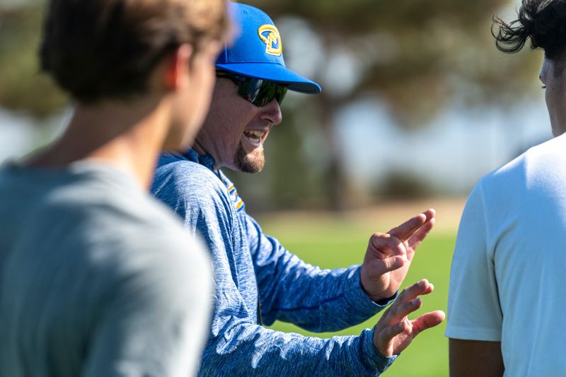 Serrano head coach Casey Maholchic teaches blocking techniques during a recent summer football practice. Serrano opens the season against Eisenhower on Aug. 23.