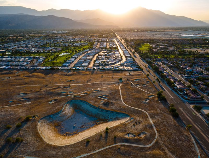 The golf course surrounding a dried lakebed at the former Santa Rosa Country Club in Palm Desert, seen Sept. 2, 2024.