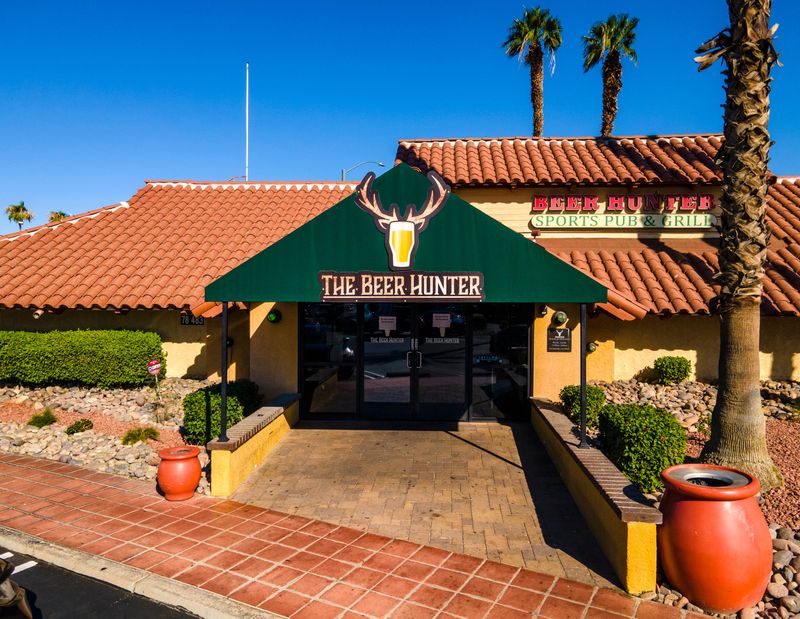 The Beer Hunter sports pub is seen with signs on the front door marking its closure in La Quinta, Calif., Wednesday, Sept. 25, 2024.