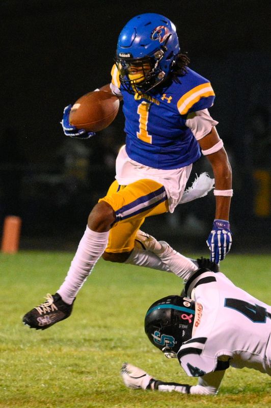 Serrano's Jamal Larry jumps over Sultana's Isaiah Vargas during the fourth quarter on Thursday, Oct. 17, 2024.