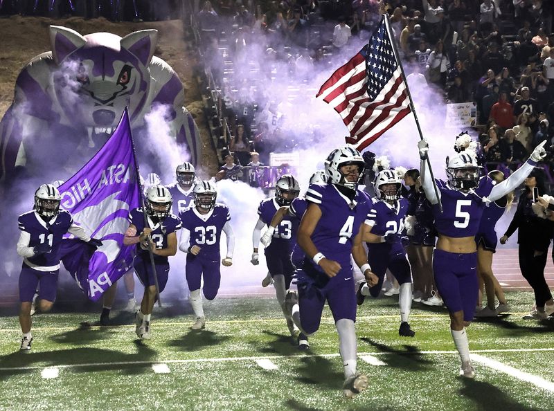 The Shasta High School football team storms onto the field for River Bowl XXXII on Oct. 18, 2024.