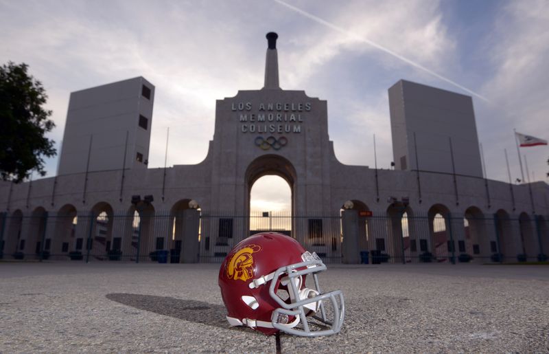 Mar 4, 2016; Los Angeles, CA, USA; General view of Southern California Trojans football helmet and the Olympic torch at the peristyle end of the Los Angeles Memorial Coliseum. The Coliseum operated by USC will serve as the temporary home of the Los Angeles Rams after NFL owners voted 30-2 to allow Rams owner Stan Kroenke (not pictured) to relocate the franchise from St. Louis for the 2016 season. Mandatory Credit: Kirby Lee-USA TODAY Sports