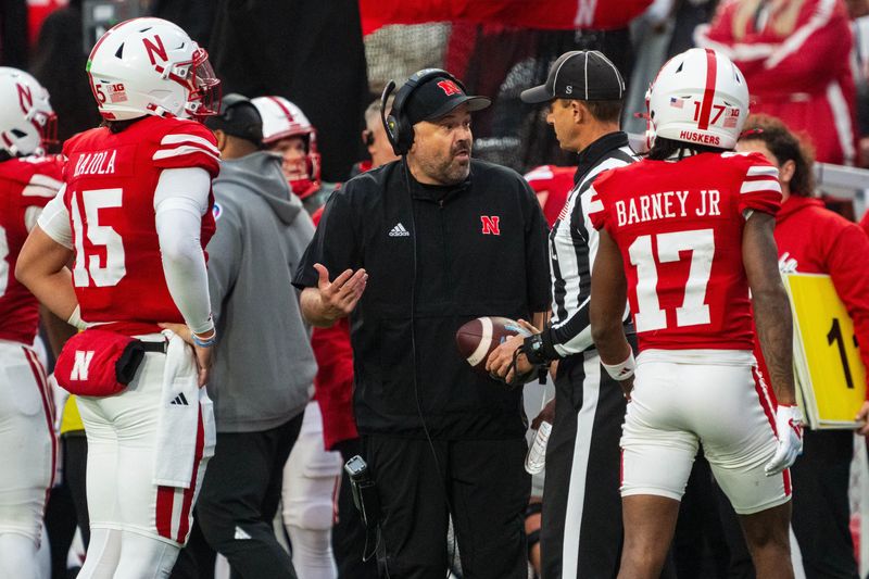 Nov 2, 2024; Lincoln, Nebraska, USA; Nebraska Cornhuskers head coach Matt Rhule talks with an official against the UCLA Bruins during the fourth quarter at Memorial Stadium. Mandatory Credit: Dylan Widger-Imagn Images