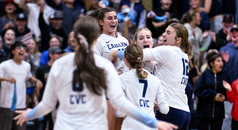 Central Valley Christian's Lola Highstreet, right, and teammates celebrate their over San Joaquin Memorial in a Central Section Division II high school volleyball championship on Thursday, November 7, 2024.