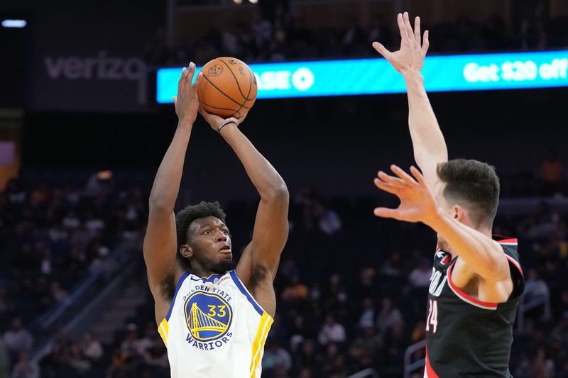 October 11, 2022; San Francisco, California, USA; Golden State Warriors center James Wiseman (33) shoots the basketball against Portland Trail Blazers forward Drew Eubanks (24) during the third quarter at Chase Center. Mandatory Credit: Kyle Terada-USA TODAY Sports