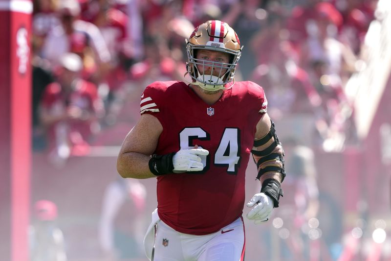 Oct 6, 2024; Santa Clara, California, USA; San Francisco 49ers center Jake Brendel (64) is introduced before the game against the Arizona Cardinals at Levi's Stadium. Mandatory Credit: Darren Yamashita-Imagn Images