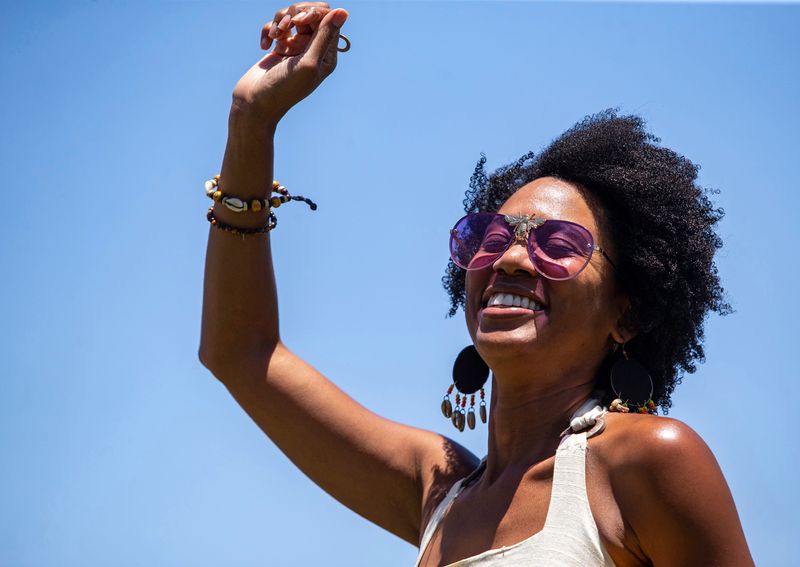 Lori Saunders-Rodgers of Palm Desert dances to music played by DJ John Paul during a Juneteenth celebration at Desert Highland Unity Center in Palm Springs, Calif., Saturday, June 18, 2022.