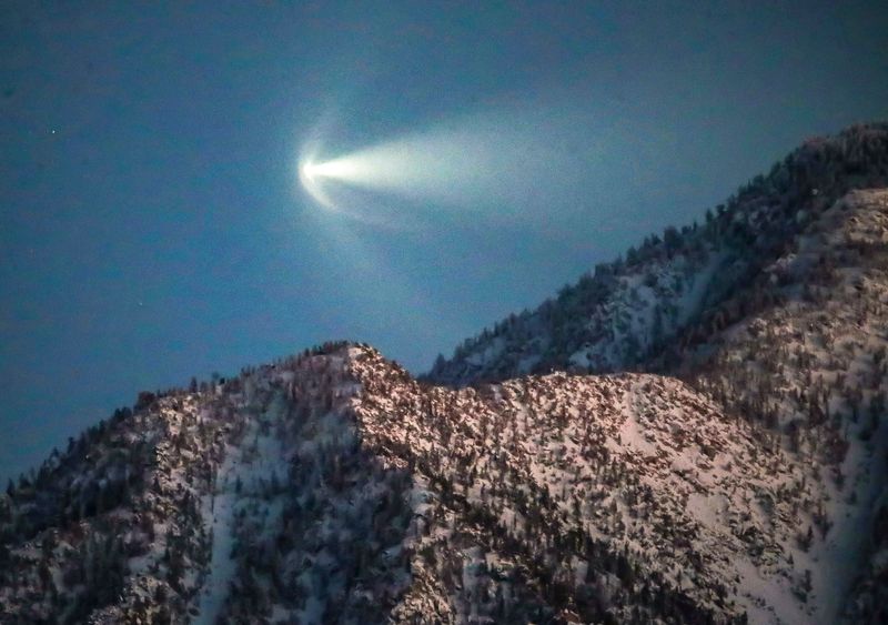 The SpaceX Falcon 9 soars into orbit above a snow-covered Mt. San Jacinto in Palm Springs, Calif., April 1, 2024.