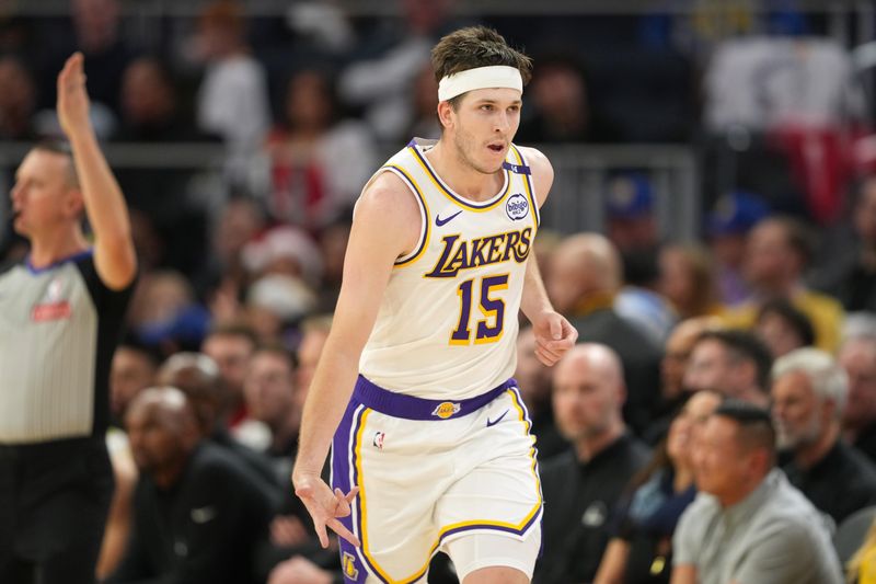 Dec 25, 2024; San Francisco, California, USA; Los Angeles Lakers guard Austin Reaves (15) gestures after making a three point basket against the Golden State Warriors during the third quarter at Chase Center. Mandatory Credit: Darren Yamashita-Imagn Images