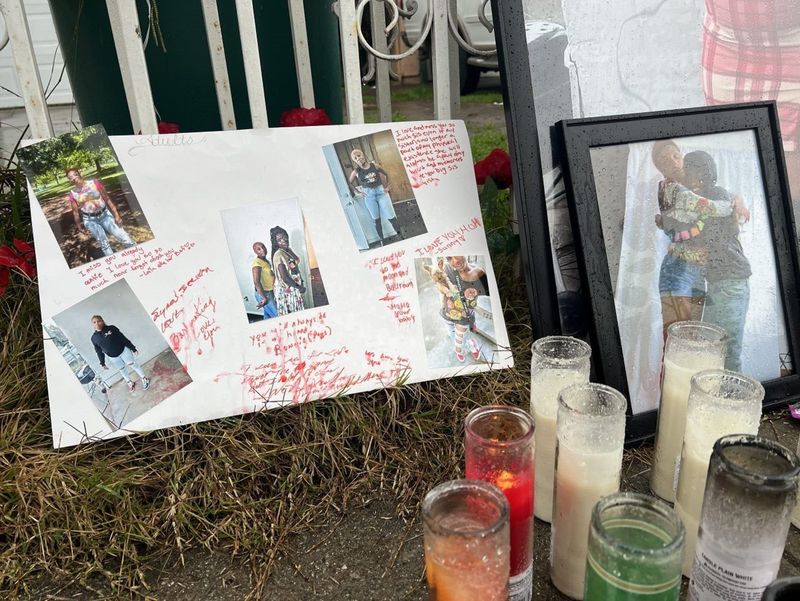 A memorial honoring the life of Latoya Scrivens is shown Friday, Jan. 3, 2025 just outside the Stockton home where a shooting occurred. Loved ones had held a vigil the night before. There were candles, a teddy bear, flowers, messages on poster boards and red and white balloons. Her son, Jkwon Williams, has been charged with voluntary manslaughter in connection to her Jan. 1 death.
