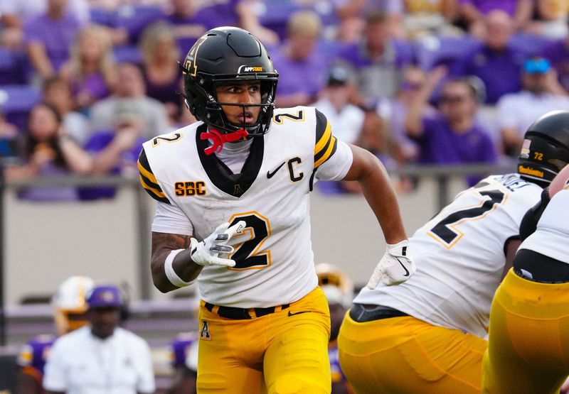 Sep 14, 2024; Greenville, North Carolina, USA; Appalachian State Mountaineers wide receiver Kaedin Robinson (2) runs in motion on the play against the East Carolina Pirates during the second half at Dowdy-Ficklen Stadium. Mandatory Credit:
James Guillory-Imagn Images