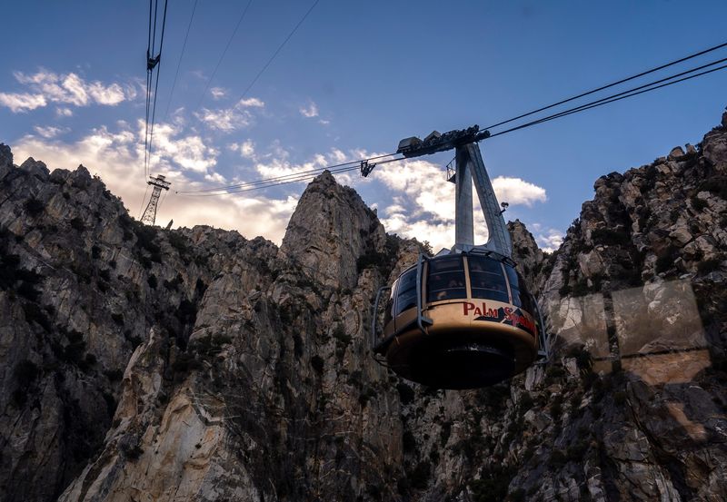 A descending tram car passes it's uphill companion on the Palm Springs Aerial Tramway line in Palm Springs, Calif., Tuesday, Jan. 7, 2025.