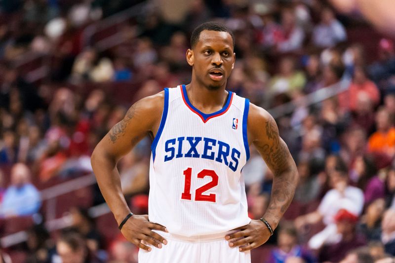 Apr 2, 2014; Philadelphia, PA, USA; Philadelphia 76ers forward James Nunnally (12) during the third quarter against the Charlotte Bobcats at the Wells Fargo Center. The Bobcats defeated the Sixers 123-93. Mandatory Credit: Howard Smith-USA TODAY Sports