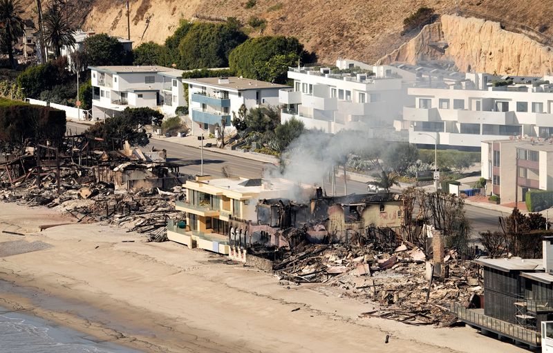 A house is seen on Jan. 10, 2025, still smoldering next to the Pacific Coast Highway in Malibu, California, from the Palisades Fire that started on Jan. 7.