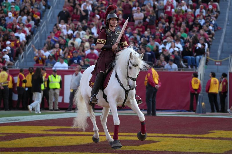 Nov 30, 2024; Los Angeles, California, USA; Southern California Trojans white horse mascot Traveler with female rider Dana Kanstul during the game against the Notre Dame Fighting Irish at United Airlines Field at Los Angeles Memorial Coliseum: Kirby Lee-Imagn Images