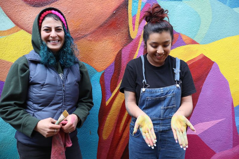 Artists Nada Abdelshahid and Katie Santiago after a day's work painting a new mural in Midtown Alley in Oldtown on Jan. 30, 2025, in Salinas, Calif.