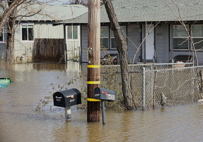 Flooding hit homes at Skyway Street and Airport Road in Redding following this week's drenching rain.