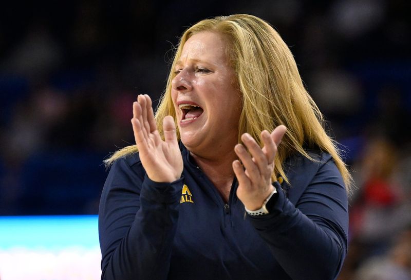 Feb 5, 2025; Los Angeles, California, USA; UCLA Bruins head coach Cori Close cheers on her team during the first quarter against the Ohio State Buckeyes at Pauley Pavilion presented by Wescom. Mandatory Credit: Robert Hanashiro-Imagn Images