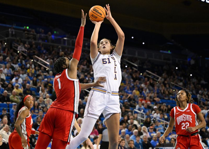 Feb 5, 2025; Los Angeles, California, USA; UCLA Bruins center Lauren Betts (51) shoots over Ohio State Buckeyes forward Ajae Petty (1) during the fourth quarter at Pauley Pavilion presented by Wescom. Mandatory Credit: Robert Hanashiro-Imagn Images
