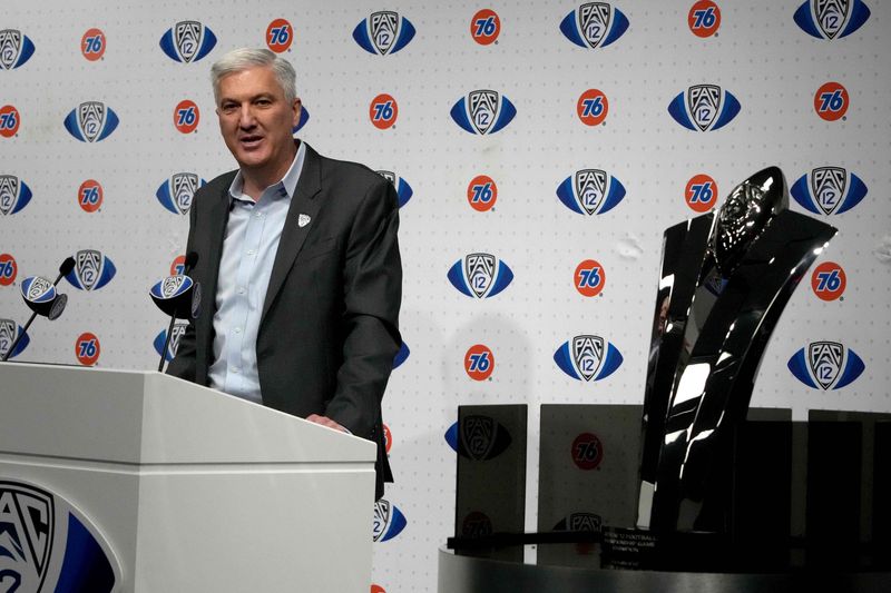 Dec 3, 2021; Las Vegas, NV, USA; Pac-12 commissioner George Kliavkoff speaks beside the championship trophy before the 2021 Pac-12 Championship Game between the Oregon Ducks and the Utah Utes at Allegiant Stadium. Mandatory Credit: Kirby Lee-USA TODAY Sports