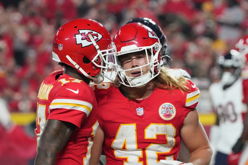 Aug 22, 2024; Kansas City, Missouri, USA; Kansas City Chiefs running back Carson Steele (42) celebrates with wide receiver Mecole Hardman (17) after scoring against the Chicago Bears during the first half at GEHA Field at Arrowhead Stadium. Mandatory Credit: Denny Medley-USA TODAY Sports