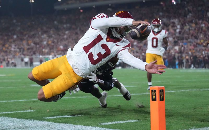 Sep 23, 2023; Tempe, Arizona, USA; USC Trojans quarterback Caleb Williams (13) dives for a touchdown against the Arizona State Sun Devils at Mountain America Stadium, Home of the ASU Sun Devils. Mandatory Credit: Joe Camporeale-USA TODAY Sports