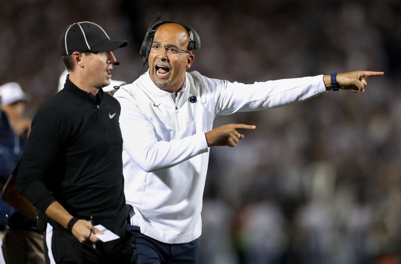 Oct 2, 2021; University Park, Pennsylvania, USA; Penn State Nittany Lions head coach James Franklin (right) reacts towards a sideline official during the first quarter against the Indiana Hoosiers at Beaver Stadium. Mandatory Credit: Matthew OHaren-USA TODAY Sports