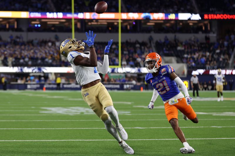 Dec 16, 2023; Inglewood, CA, USA; UCLA Bruins wide receiver J. Michael Sturdivant (1) catches a 40 yard pass for a touchdown against Boise State Broncos cornerback A'Marion McCoy (21) in the fourth quarter of the LA Bowl at SoFi Stadium. Mandatory Credit: Kiyoshi Mio-USA TODAY Sports