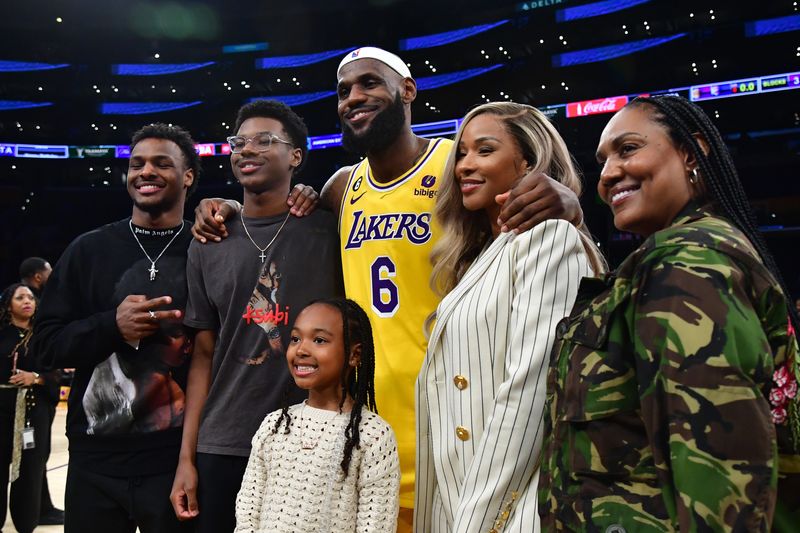 Feb 7, 2023; Los Angeles, California, USA; Los Angeles Lakers forward LeBron James (6) poses for photos with his sons Bronny and Bryce Maximus, daughter Zhuri, wife Savannah and mother Gloria after the game against the Oklahoma City Thunder at Crypto.com Arena. Mandatory Credit: Gary A. Vasquez-USA TODAY Sports