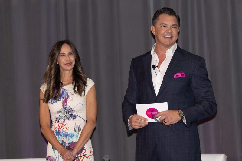 Bronwyn Liv Ison (Summit CEO) and Robert L. Schein (Summit Founder) address the crowd at the Confidence Summit: Women + Wealth + Wellness on Feb. 7, 2025.