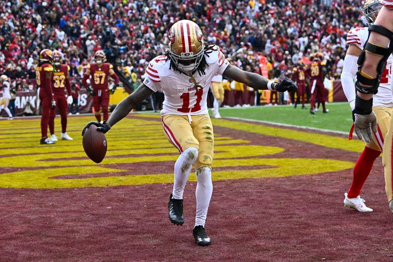 Dec 31, 2023; Landover, Maryland, USA; San Francisco 49ers wide receiver Brandon Aiyuk (11) celebrates after scoring a touchdown against the Washington Commanders during the second half at FedExField. Mandatory Credit: Brad Mills-USA TODAY Sports