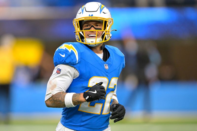 Dec 15, 2024; Inglewood, California, USA; Los Angeles Chargers cornerback Elijah Molden (22) celebrates after a fumble recovery in the first half against the Tampa Bay Buccaneers at SoFi Stadium. Mandatory Credit: Jayne Kamin-Oncea-Imagn Images