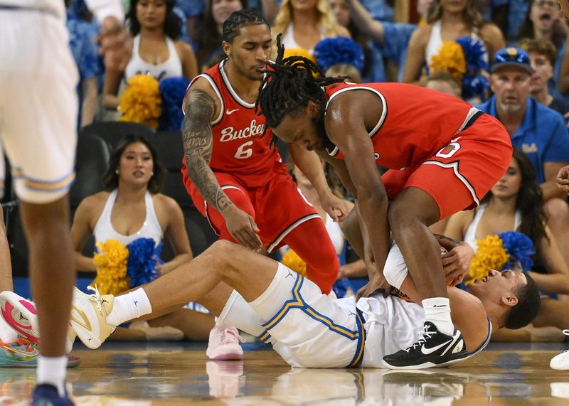 Feb 23, 2025; Los Angeles, California, USA; UCLA Bruins guard Kobe Johnson (0), Ohio State Buckeyes guard Ques Glover (6) and guard Bruce Thornton (2) fight for a loose ball during the first half at Pauley Pavilion presented by Wescom. Mandatory Credit: Robert Hanashiro-Imagn Images
