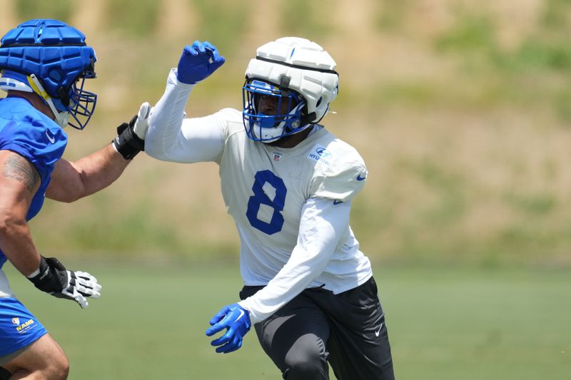 May 21, 2024, Thousand Oaks, California, USA; Los Angeles Rams defensive end Jared Verse (8) wears a Guardian helmet cap during organized team activities at Cal Lutheran University. Mandatory Credit: Kirby Lee-USA TODAY Sports
