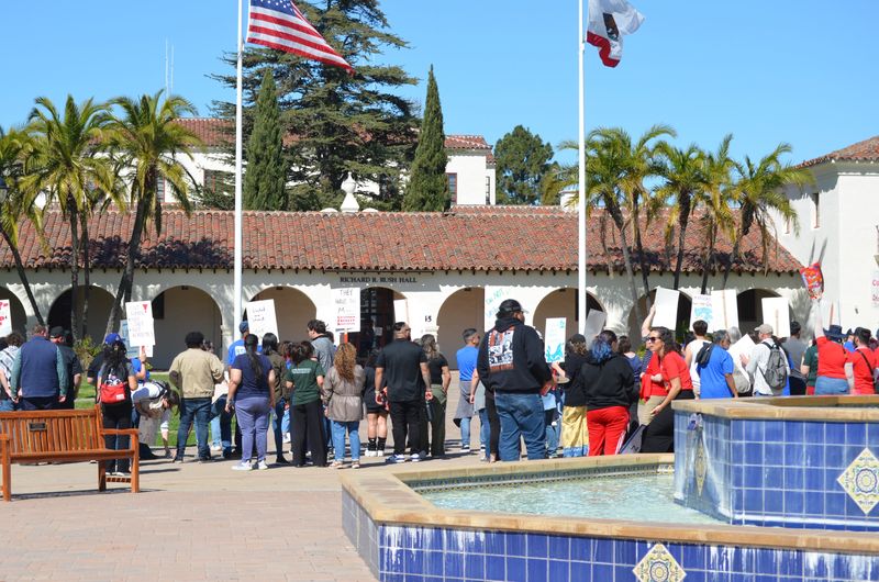 CSUCI employees protest likely job cuts and layoffs in February. On June 12, the university laid off 13 employees.