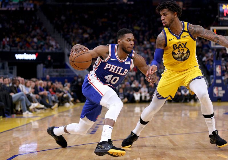 Mar 7, 2020; San Francisco, California, USA; Philadelphia 76ers forward Glenn Robinson III (40) dribbles the ball against Golden State Warriors forward Marquese Chriss (32) in the second quarter at the Chase Center. Mandatory Credit: Cary Edmondson-USA TODAY Sports
