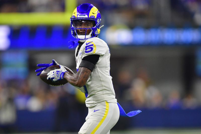 Oct 24, 2024; Inglewood, California, USA; Los Angeles Rams wide receiver Tutu Atwell (5) runs the ball after catching a pass against the Minnesota Vikings during the second half at SoFi Stadium. Mandatory Credit: Gary A. Vasquez-Imagn Images