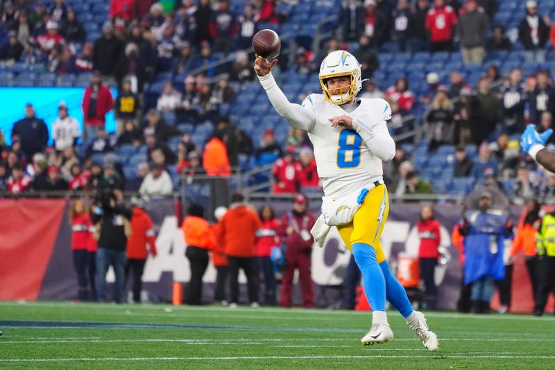 Dec 28, 2024; Foxborough, Massachusetts, USA; Los Angeles Chargers quarterback Taylor Heinicke (8) throws the ball against the New England Patriots during the second half at Gillette Stadium. Mandatory Credit: Gregory Fisher-Imagn Images