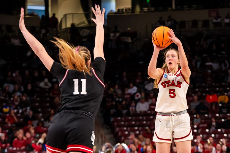 Mar 21, 2025; Columbia, South Carolina, USA; Utah Utes guard Gianna Kneepkens (5) attempts a three point basket over Indiana Hoosiers forward Karoline Striplin (11) in the second half at Colonial Life Arena. Mandatory Credit: Jeff Blake-Imagn Images