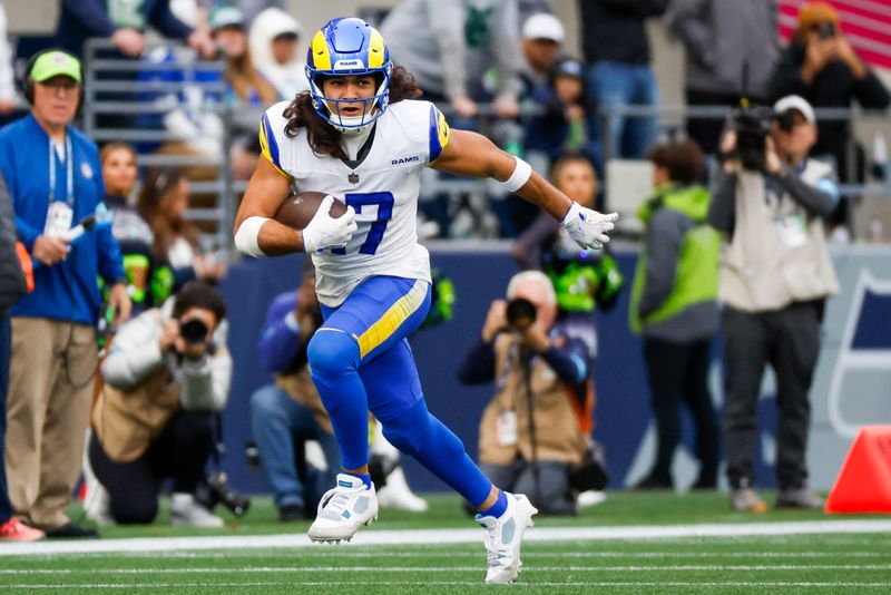 Nov 3, 2024; Seattle, Washington, USA; Los Angeles Rams wide receiver Puka Nacua (17) runs for yards after the catch against the Seattle Seahawks during the second quarter at Lumen Field. Mandatory Credit: Joe Nicholson-Imagn Images
